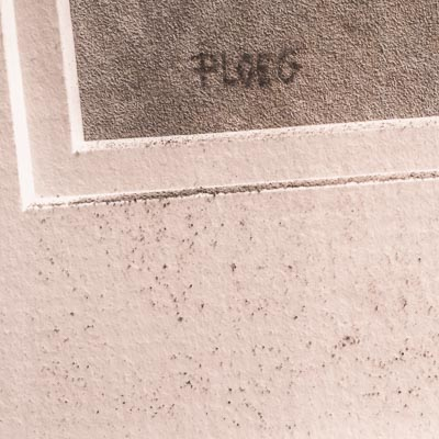 Brown staining at artwork edge from acid mat board